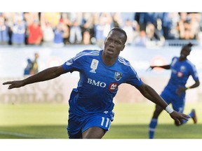 Montreal Impact's Didier Drogba celebrates after scoring against D.C. United during first half MLS soccer action in Montreal, Saturday, Sept. 26, 2015.