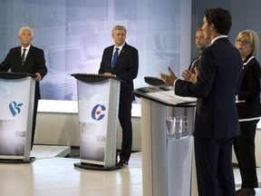 Bloc Québécois Leader Gilles Duceppe, left to right, Conservative Leader Stephen Harper, NDP Leader Tom Mulcair, Green Party Leader Elizabeth May and Liberal Leader Justin Trudeau trade words during the French-language debate on Thursday, September 24, 2015, in Montreal.