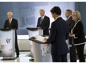 Bloc Québécois Leader Gilles Duceppe, left to right, Conservative Leader Stephen Harper, NDP Leader Tom Mulcair, Green party Leader Elizabeth May and Liberal Leader Justin Trudeau take part in the French-language debate Thursday, Sept. 24, 2015, in Montreal.