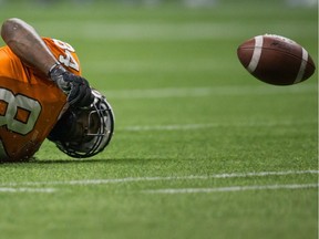 B.C. Lions' Emmanuel Arceneaux falls to the ground as the ball bounces after he failed to make the reception during the second half of a CFL football game against the Montreal Alouettes in Vancouver, B.C., on Thursday August 20, 2015.