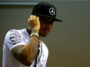 Lewis Hamilton walks in the paddock after practice for the Formula One Grand Prix of Singapore at the Marina Bay Street Circuit on Sept. 18, 2015 in Singapore.