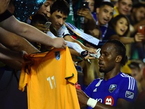 Didier Drogba of the Montreal Impact meets with fans and signs autographs following a 0-0 draw with the L.A. Galaxy in MLS match on Sept. 12, 2015 in Carson, Calif.
