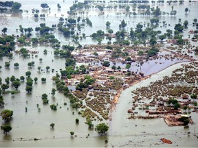 This file photo shows an aerial view of the flooded Rohjan area in southern Pakistan. UN climate experts say global warming accelerated since the 1970s, breaking more countries' temperature records than ever before.