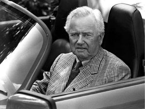 This undated file photo shows Professor Ferdinand 'Ferry' Porsche sitting at the wheel of a Porsche convertible. 