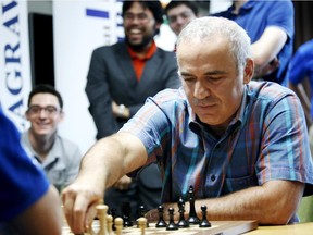 World chess legend Garry Kasparov makes a move during a series of rapid and blitz exhibition games called Ultimate Moves held following the 2015 Sinquefield Cup at the Chess Club and Scholastics Center of St. Louis on September 3, 2015.