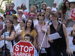 Anti-Harper citizens sang "Harperman" in Dorchester Square on Sept. 17, 2015.