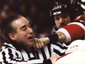 New Jersey Devils'  Mike Peluso bounces a punch off Canadiens' Lyle Odelein and nails linesmen Gérard Gauthier in the chin at the Forum on March 1, 1996.