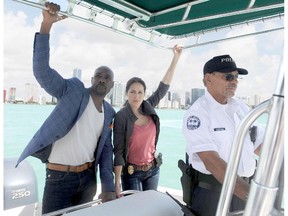 Morris Chestnut, left, and Jaina Lee Ortiz appear in a scene from Rosewood, premiering Sept. 23.