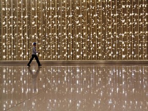 A worker walks through the new terminal at the Chhatrapati Shivaji International Airport in Mumbai, India, in 2014.