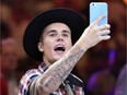 Justin Bieber hopes fans will put their phones on hold.