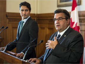 Liberal leader Justin Trudeau and Montreal mayor Denis Coderre respond to questions following a meeting at Montreal City Hall Sept. 3, 2015.