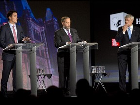 Liberal leader Justin Trudeau, left, NDP leader Tom Mulcair and Conservative leader Stephen Harper, right, take part in the Globe and Mail hosted leaders’ debate, Thursday Sept. 17, 2015 in Calgary.