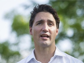 Liberal Leader Justin Trudeau speaks to the media during a federal election campaign stop in Laval.