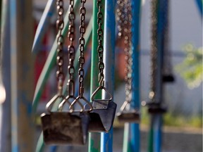 An empty swing set in a Quebec playground.