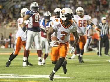 B.C. Lions' Lavelle Hawkins, centre, runs in for a touchdown during first half CFL football action against the Montreal Alouettes in Montreal on Thursday, September 3, 2015.