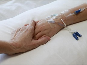 Local Input~// //  **FOR NATIONAL POST USE ONLY - NO POSTMEDIA**   UNDATED --  elderly hands sick dying couple holding hands IV intravenous needle tube I.V. hospital bed  CREDIT: PHOTO  BY FOTOLIA (FOR NATIONAL POST USE ONLY)/pws  // Na120914-Coyne    // na121114-consent    na020315-euthanasia na020715-coyne na020715-fallout  na022315-euthanasia  // 0905 na suicide ORG XMIT: POS1309271725361185