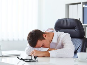 Young businessman in white shirt sleeping