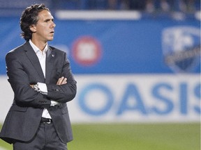 Impact head coach Mauro Biello looks on from the bench during second half of MLS game against the Chicago Fire at Montreal's Saputo Stadium on Sept. 5, 2015.
