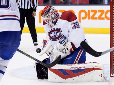 Montreal Canadiens goaltender Mike Condon makes a save during second period pre-season exhibition NHL hockey action against the Toronto Maple Leafs in Toronto on Saturday, September 26, 2015.