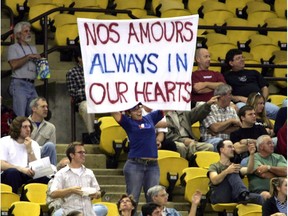 A fan shows her support for the home-town team during a game between the Expos and the New York Mets at Olympic Stadium near the end of the season in 1994.