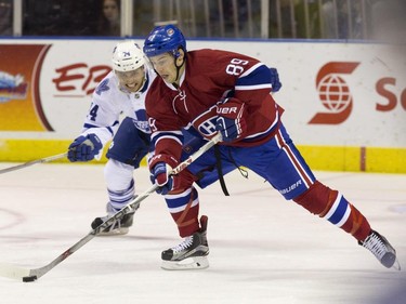 Montreal Canadiens defenceman Ryan Johnston is chased by Toronto Maple Leafs forward Michael Joly as he looks to clear the puck during their NHL Rookie Tournament hockey game at Budweiser Gardens in London, Ont., on Saturday, September 12, 2015.
