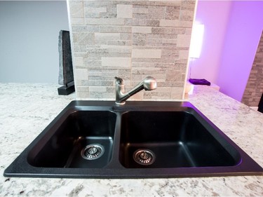The sink in the kitchen is made of lava stone.