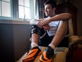 MONTREAL, QC.: SEPTEMBER 11, 2015 -- Demitri Evangeliou poses for a photo in his room, on Friday September 11, 2015, in Kirkland, Quebec. He badly injured his knee last December playing soccer. Ever since he's been looking for ways to fill his time and give back, so he is volunteering. (Giovanni Capriotti / MONTREAL GAZETTE)