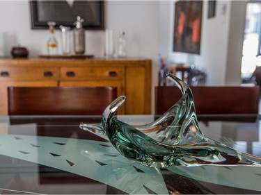 A glass artwork on top of the dining table.