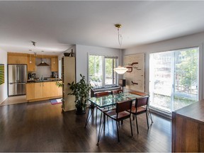 A view of the dining room and kitchen.