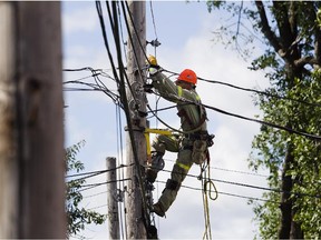 A Hydro Quebec worker  works to restore power.