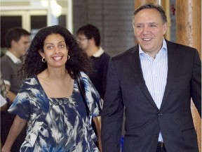 Dominique Anglade, former CAQ president (L) and Francois Legault, (R) CAQ leader walking in the CAQ headquarters in Montreal in July 2012.