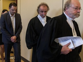 Guy Turcotte exits the courtroom for a break at the Palais de Justice in St-Jerome on Tuesday, June 23, 2015, Guy Turcotte, during a hearing ahead of his second murder trial, which begins jury selection next week.