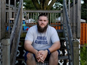 Alouettes offensive-tackle Jeff Perrett sits in the backyard of his home in Montreal on June 24, 2015.