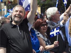 Tom Mulcair takes part in the Fête nationale parade in June 2015. Can the NDP recapture Quebec without him?