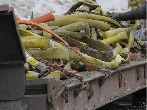 Frozen firehoses on a large trailer.