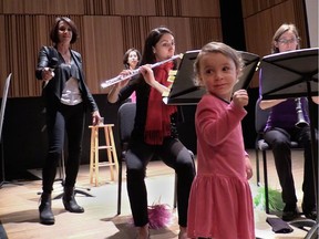 Vivian Ventura McCormick 'conducts' musicians at McGill's Tanna Schulich Hall at a Bach Before Bedtime concert in Montreal on Thursday, March 12, 2015. Bach Before Bedtime is a program of the Allegra chamber music series, founded by Dorothy Fieldman Fraiberg, left.  A gala event celebrating the 35th anniversary of Allegra is set to take place Sept. 30, 2015.