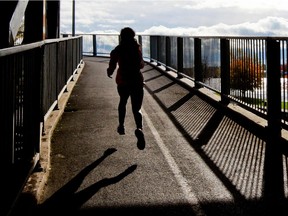 A runner heads up the spiral ramp linking Ste.-Anne-de-Bellevue with Highway 20 and Ile Perrot in St.-Anne-de-Bellevue, west of  Montreal Wednesday October 23, 2013.