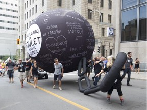 Public-sector workers march in downtown Montreal during a demonstration against the slow pace of negotiations with the government on Sept. 3, 2015.