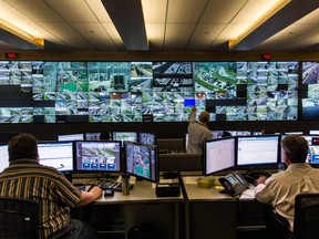 Workers watch live video feeds at Transport Quebec's upgraded traffic-control centre in Montreal on Tuesday, Sept. 1, 2015.
