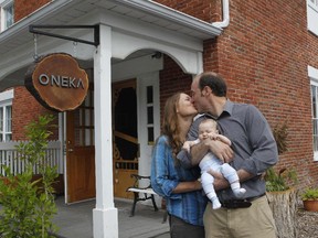 The smell alone makes it worth popping into Oneka, a boutique in Frelighsburg owned by Philippe Choinière, right, and his wife, Stacey Lecuyer-Choinière. In their arms: their 3-month-old, Raphaelle.