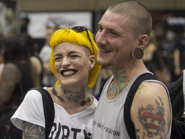 Jenna Hynes and Damon Nickel enjoy the art tattoo show held in Montreal on Friday September 11, 2015. The show at Place Bonaventure goes on through the weekend.