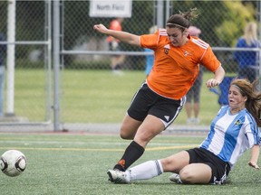 Dorval Tigers player Sarah Rogers, left, fights for the ball against Trois Lacs player Jessica Ball, right, during the Lac St. Louis U-18 girls soccer final in September 2012.