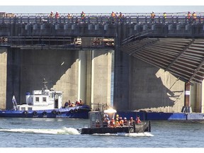 Crews search for a missing man following a platform collapse at the Champlain Bridge worksite Sept. 15, 2015.