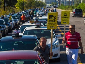 Local cabdrivers gathered the Techno Park in Montreal, on Wednesday, September 16, 2015 to protest Uber being able to operate in the city.