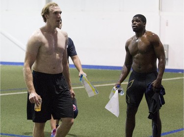 Montreal Canadiens forward Dale Weise (left) and defenceman P.K. Subban move on to the next station after taking a physical test.
