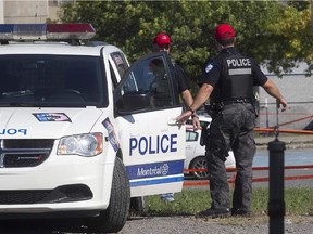 Montreal police officers at shooting scene at the Lasalle Aquadome on Lapierre street on Thursday September 17, 2015.