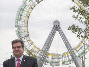 Montreal Mayor Denis Coderre stands in front of the new urban art called Vélocité des Lieux, following its inauguration on Saturday, Sept. 19, 2015. The piece is on permanent display on the corner of Pie-IX and Henri-Bourassa.