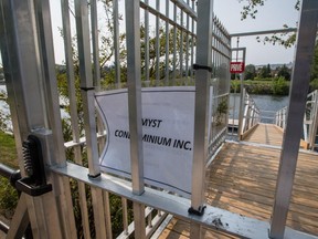 A private dock on the Lachine Canal constructed by the Myst sur le Canal condo project in Montreal on Wednesday, September 2, 2015. Several Montreal city councillors have called for similar privately-owned docks to become open to the general public since they sit on public land managed by Parks Canada.