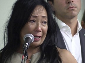 Kathy Nakashima is overcome with emotion as she spoke at a public consultation meeting Thursday, Sept. 3, 2015. She was in support of a controversial development project near the new MUHC superhospital in NDG. She was speaking of her son who was a patient at Montreal Children's Hospital.