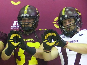 Concordia football players Andrew Barlett, left, and Keegan Treloar, show the new Stingers logo printed inside their gloves during a presser at the university on Wednesday Sept. 2nd, 2015. The new Stingers brand, logo and uniforms is the result of consultation with students, coaches, athletes and alumni.